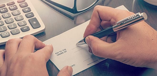 How can an NRI remit premium to the insurance companies?