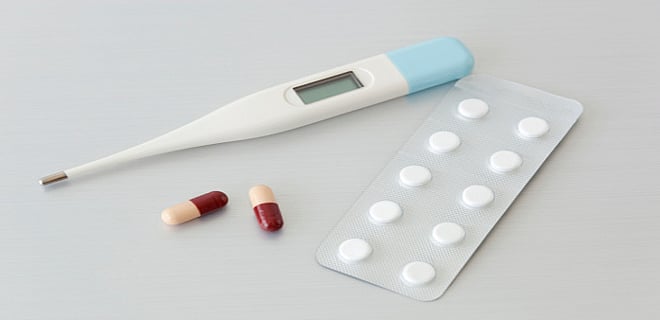 When is the payment made under a critical illness rider attached with a policy?