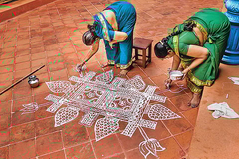 Families decorate their houses with intricate kolam for pongal