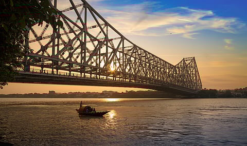 The historic Howrah Bridge at sunrise