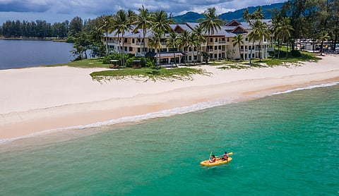 The resort is located between a tropical lagoon and the beautiful Bang Tao Beach