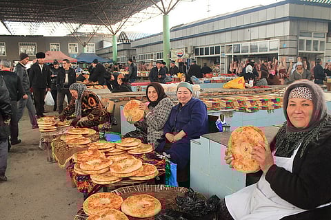 Women selling local breads in Urgut market, Uzbekistan