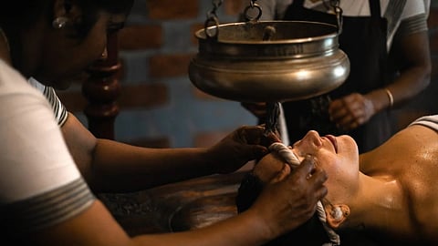 a healing session in ayurveda at The Ayurvedic Healing Village in Kairali, Kerala