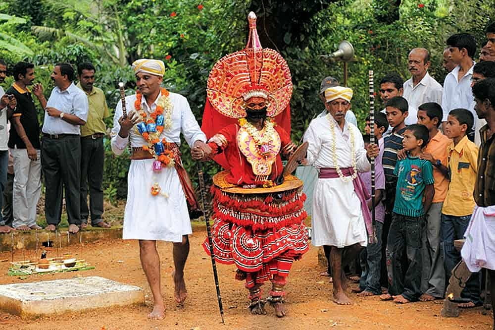 The person performing 'bhuta kola', a traditional dance wears special makeup, jewellery and costumes. He dances to very unique tunes of music
