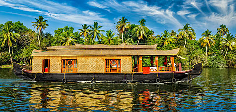 Boat ride along the backwaters is a popular tourist activity in Kerala