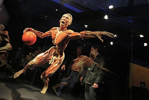 A display of a dead corpse playing basketball