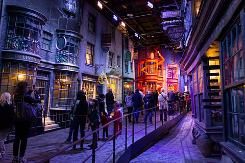 People at the Warner Bros Studios London tour, on the sets and among original material from the Harry Potter movies.