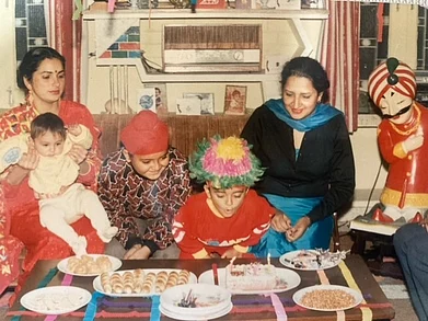 A photo of the author (as a baby in his mothers lap) and his family with Maharaja in the left corner