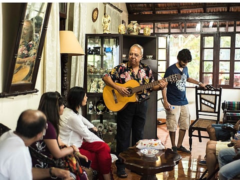 Mr. Chico serenading guests in his  home