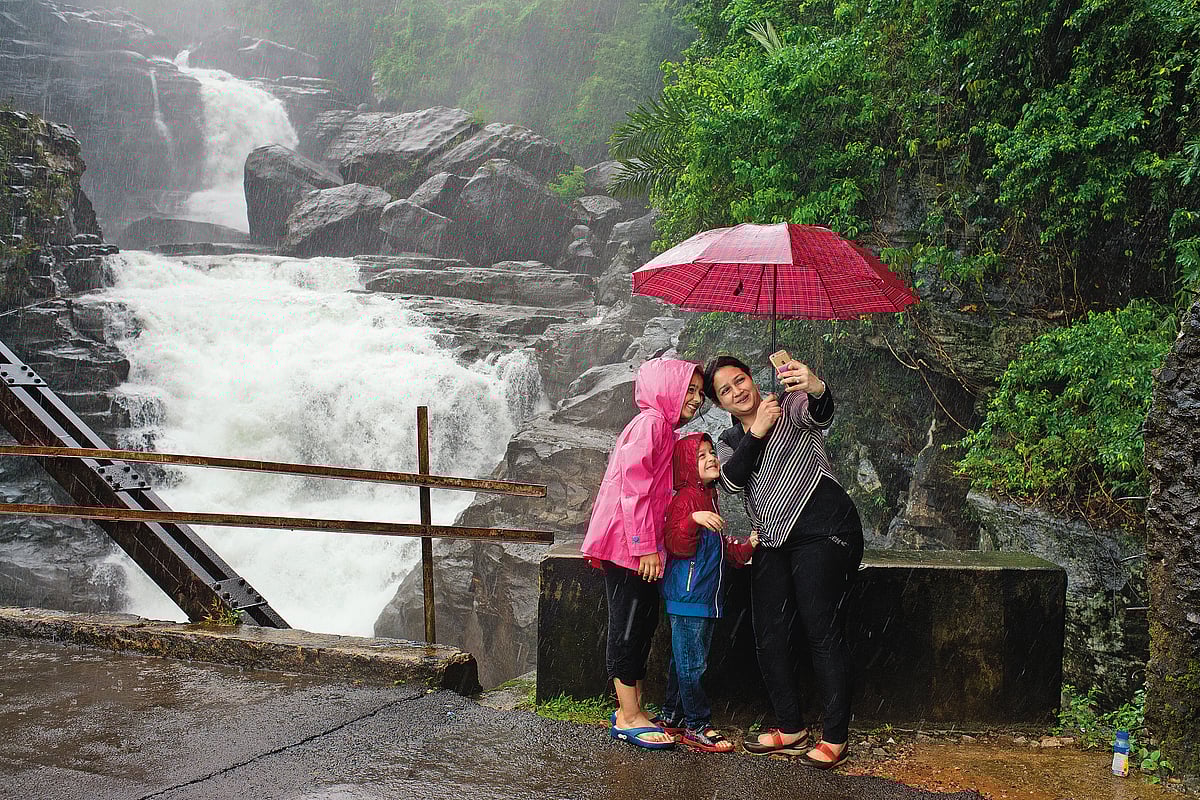 A family capturing rain-soaked memories