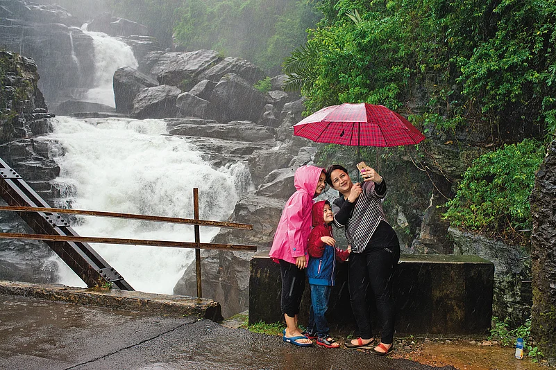 A family capturing rain-soaked memories