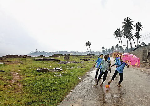 Kids enjoying the monsoons in Kerala