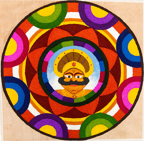 King Mahabali at the centre of a Pookalam