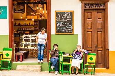Chris Pictures / Shutterstock : A colourful cafe in the main square in Jardin, Colombia