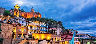 Monticello / Shutterstock : View of the Old Town of Tbilisi after sunset