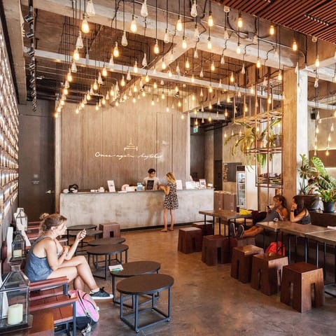 Once Again hostel in Bangkok boasts contemporary interiors in warm colours