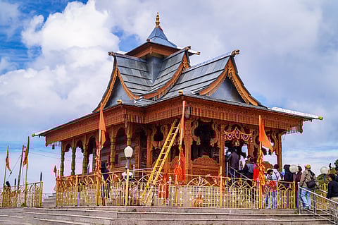 Hatu Temple features ornate wood-carved interiors and scenic views from an elevated peak