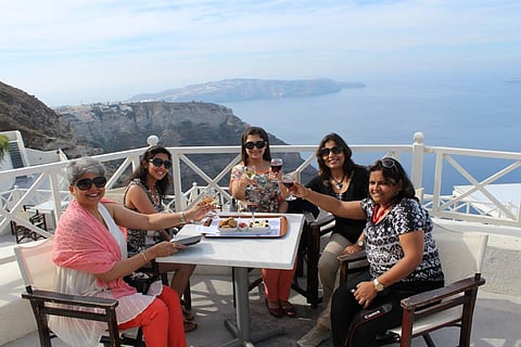 A travel group enjoying a scenic outdoor breakfast