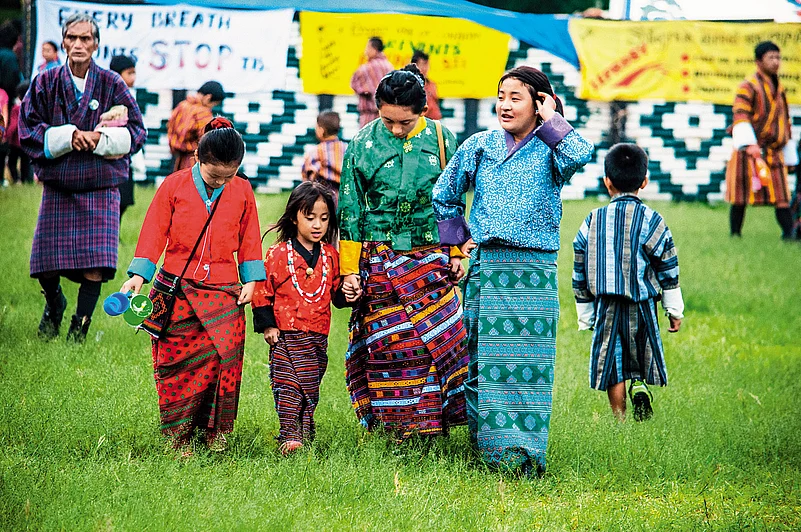 Children wearing Bhutans traditional attire, Kira