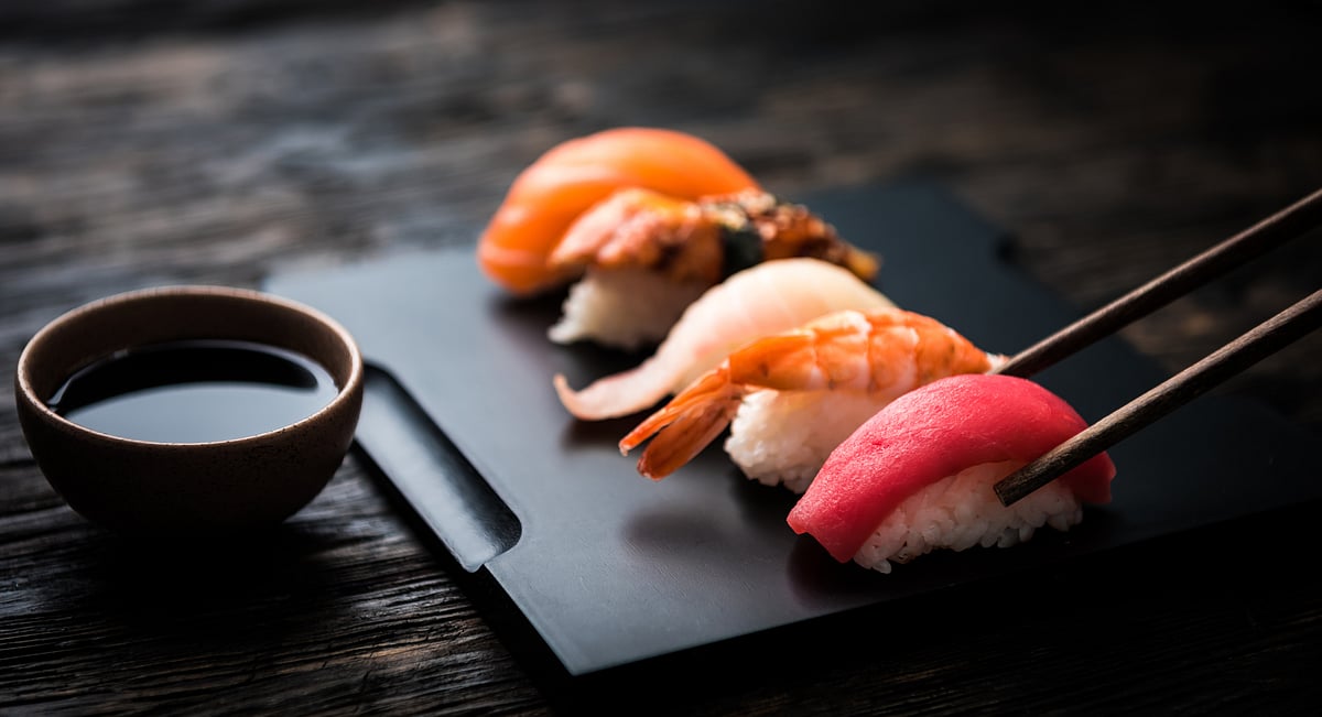 Sashimi sushi set with chopsticks and soy
