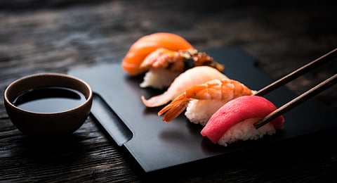 Sashimi sushi set with chopsticks and soy