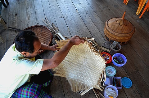 Chowkim Singpho making the upper portion of a phon