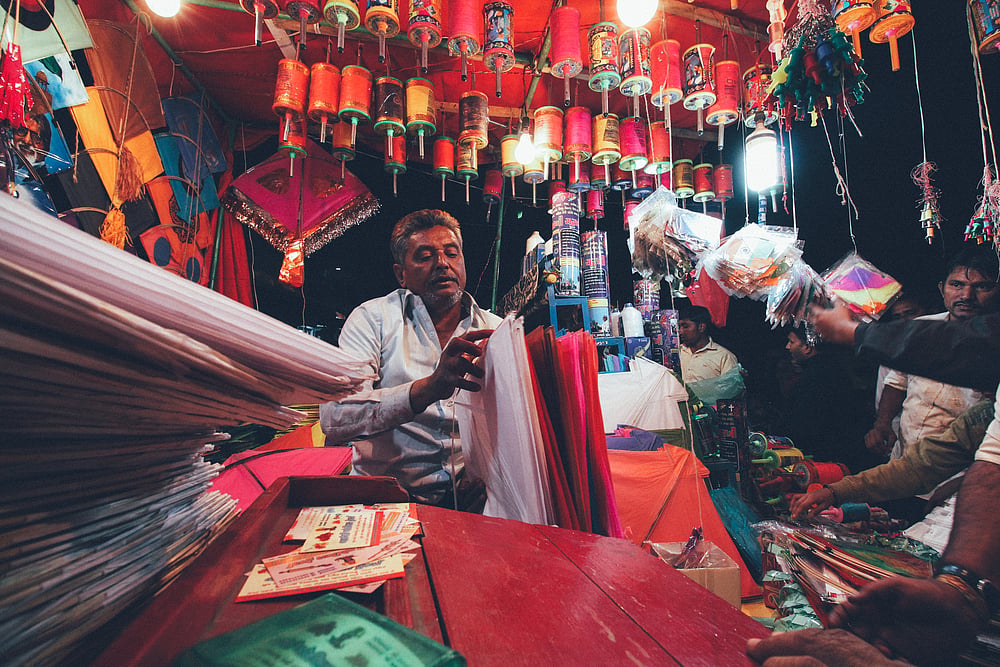 A street hawker selling kites