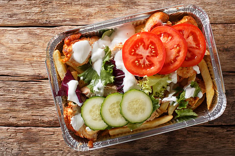Kapsalon is a combination of fries, topped with meat, sauce, cheese