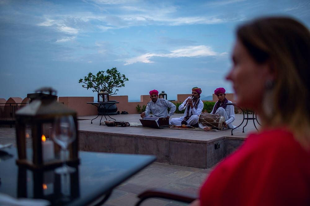 Rajasthani musicians serenade a guest with traditional music