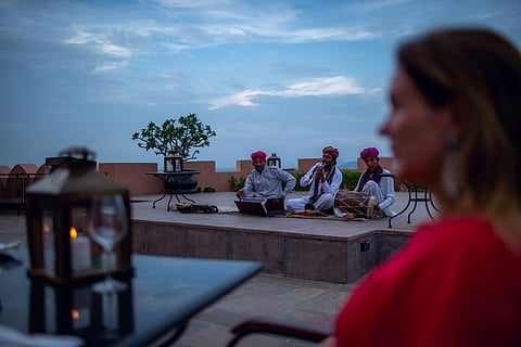 Rajasthani musicians serenade a guest with traditional music