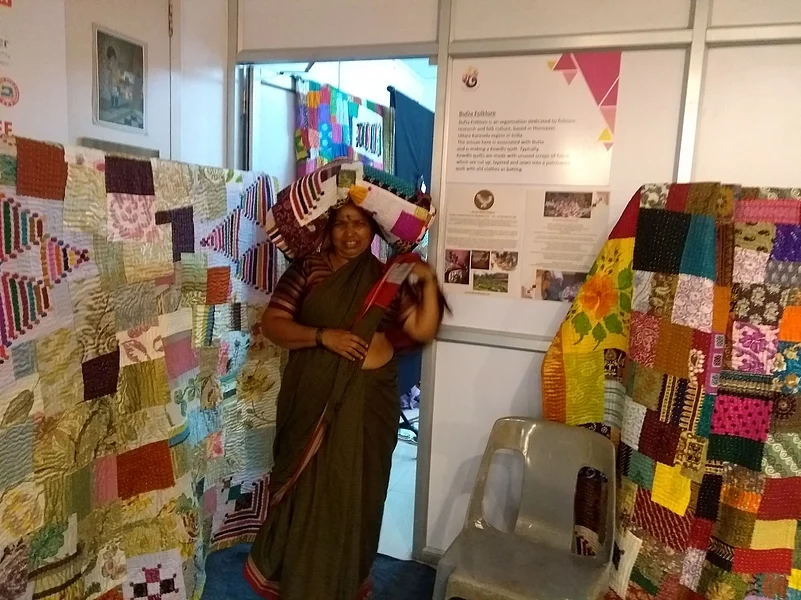 At an event showcasing kowdhi quiltmaking