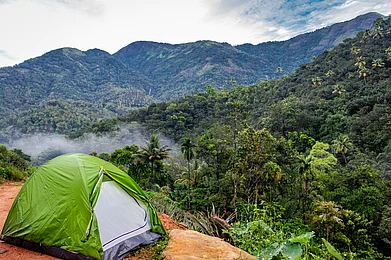 Shutterstock : A solo travellers tent on the Vagamon mountains