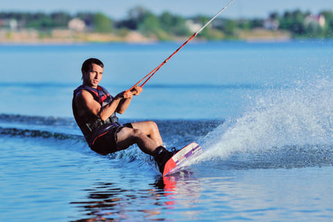 A man wakeboarding