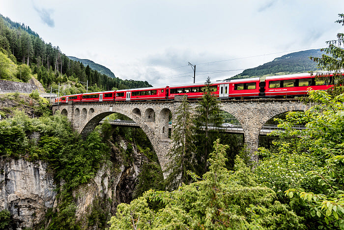 Swiss Travel System (STS) seamlessly integrates air, train, and bus travel, primarily powered by clean hydropower