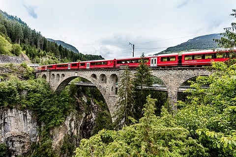 Swiss Travel System (STS) seamlessly integrates air, train, and bus travel, primarily powered by clean hydropower