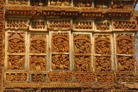 Intricate carvings on terracotta bricks 