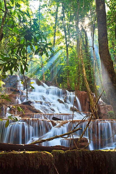 Depositphotos : A waterfall in Laos, one of the places where Indian currency prevails over the local