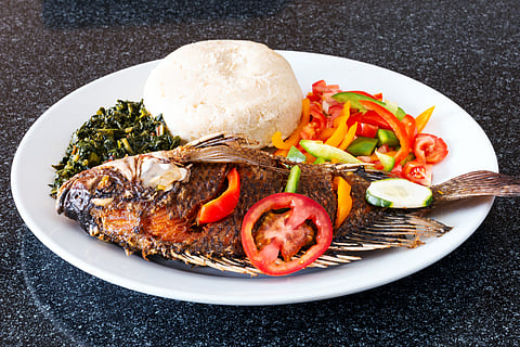 Ugali served with Fish, Kales, and Kachumbari