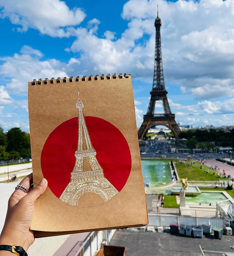 Banerjee took her alpona art of the Eiffel Tower all the way to Paris just to take this one photograph