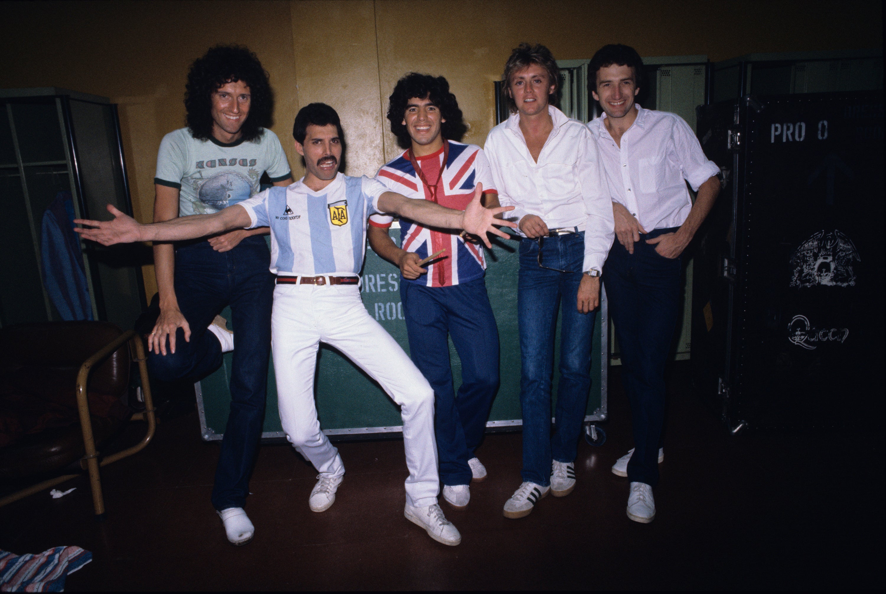 English rock band Queen (with Freddy Mercury in an Argentina jersey) meeting Diego Maradona (wearing an Union Flag jersey) before their last concert in Argentina during the The Game Tour, 1980.