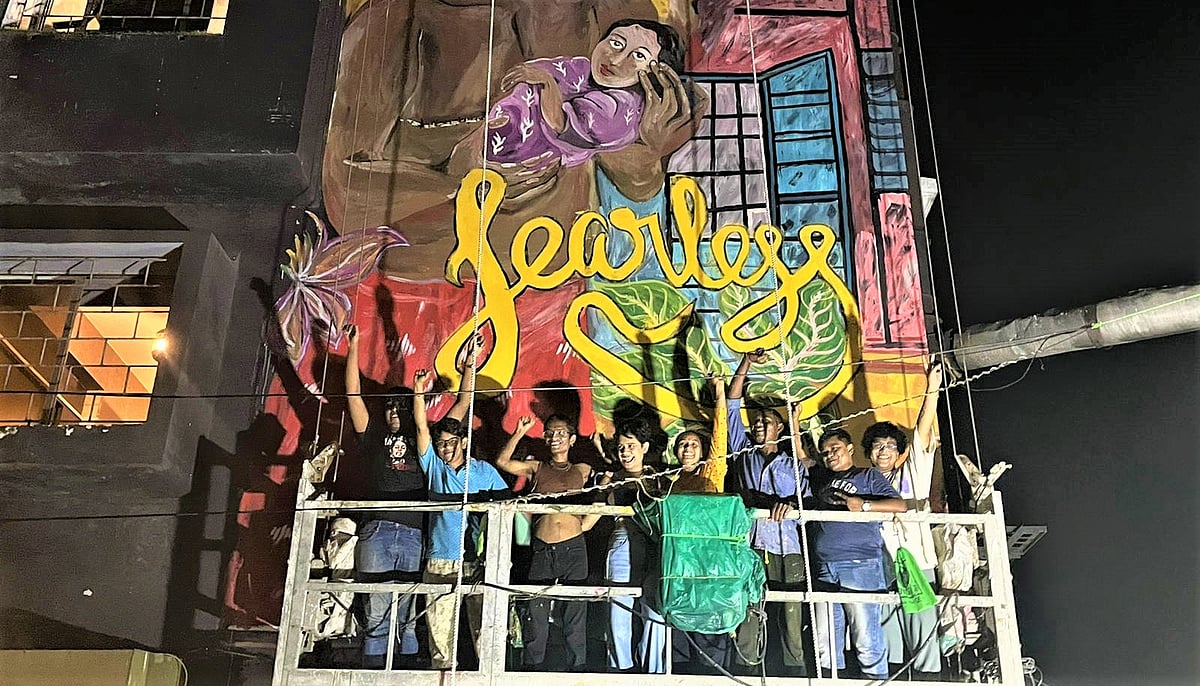 Nadini Moitra : The crew with Nandini Moitra (fourth from left) in front of the mural