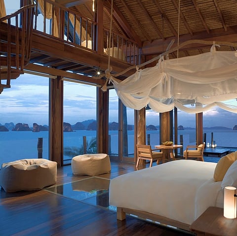 This vast one-bedroom villa features spacious double-height vaulted ceilings, an infinity pool and pool bar for do-it-yourself cocktails, a large outdoor sun terrace, and a mini cinema