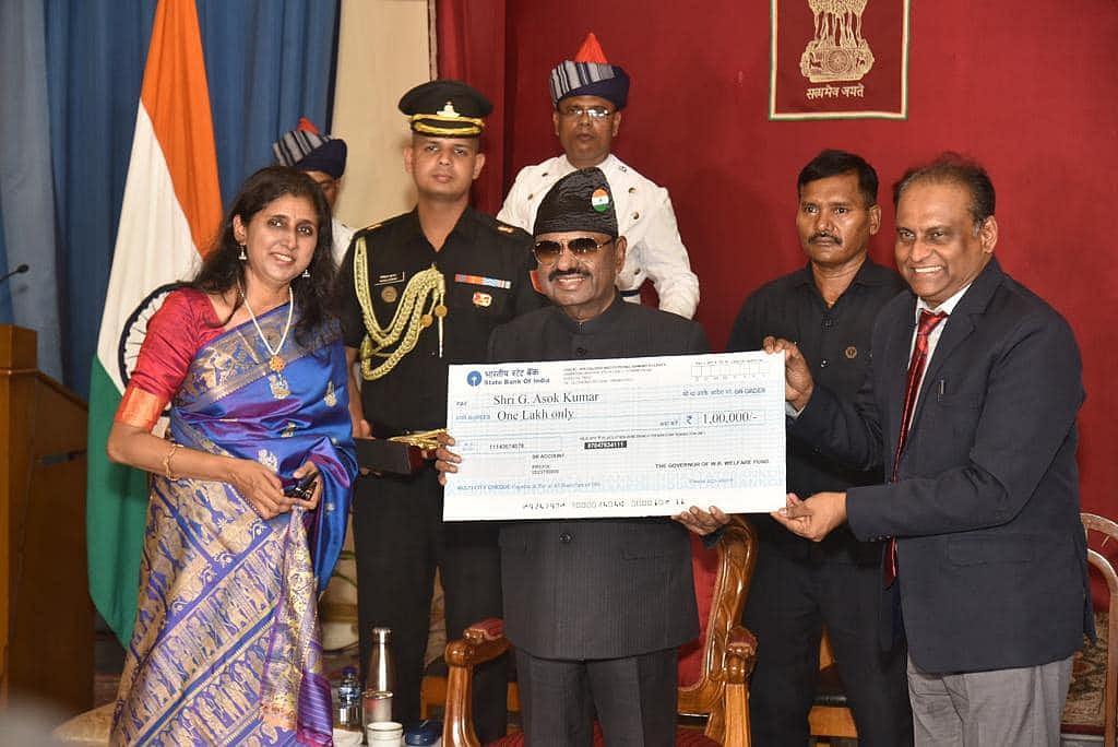 G Asok Kumar receiving the honour