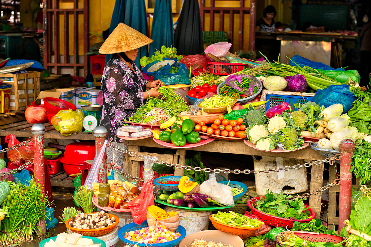 Woman selling vegetables Hoi An central Market
