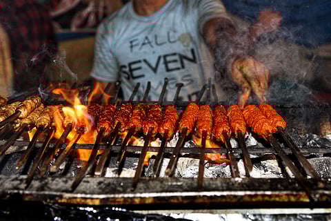 A vendor selling kebabs