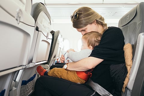 Woman with a baby on a Flight