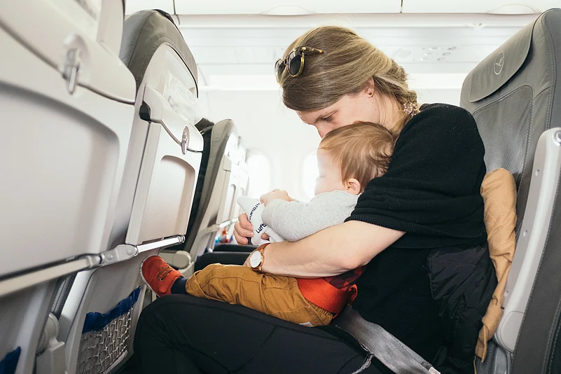 Woman with a baby on a Flight