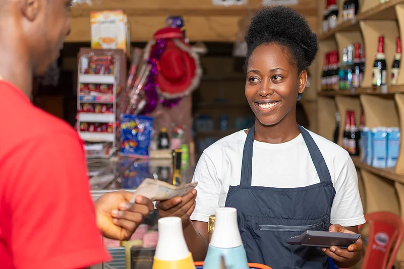 woman taking money from customer