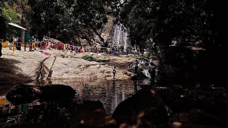 Monkey Falls descends from a height of approximately 60 ft near Aliyar Dam
