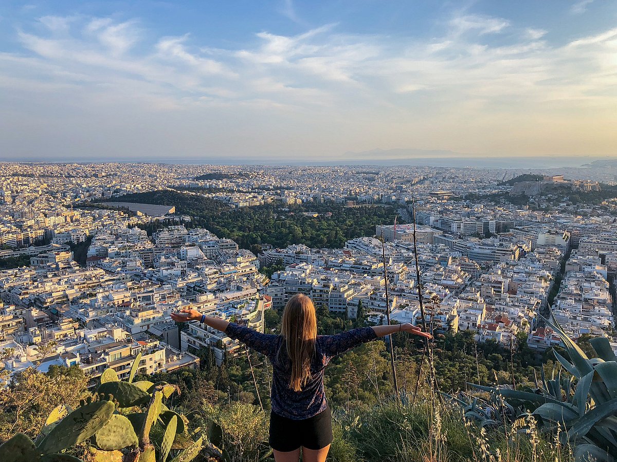 A woman posing against a view